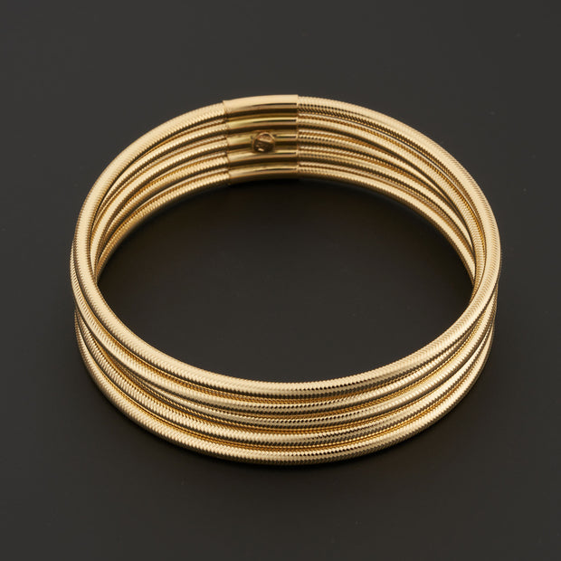 14K Yellow Gold Five-Row Flex Stretch Rounded Snake Chain Stacked Bangle Bracelet. Bichsel Jewelry in Sedalia, MO. Shop online or in-store today!