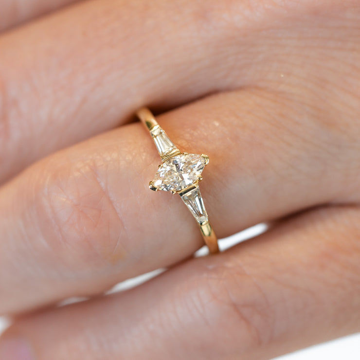 14K Yellow Gold 0.38ct Marquise Diamond Engagement Ring with 0.26ct Baguette Accent Side Stones. Bichsel Jewelry in Sedalia, MO. Shop ring styles online or in-store today!