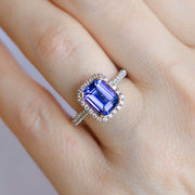 14K White & Yellow Gold 2.36ct Emerald Cut Tanzanite Ring with Diamond Halo & Diamond Accent Band. Bichsel Jewelry in Sedalia, MO. Shop gemstone rings online or in-store!