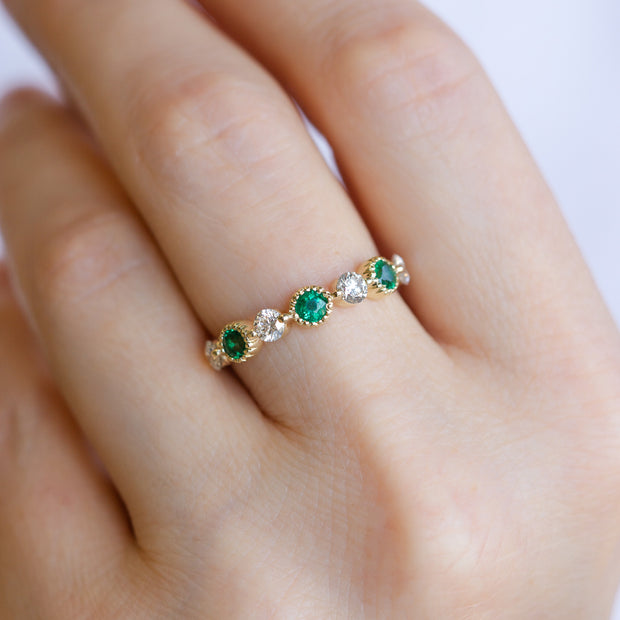 14K Yellow Gold Milgrain Alternating Round Emerald & Diamond Stackable Ring. Bichsel Jewelry in Sedalia, MO. Shop gemstone rings online or in-store!