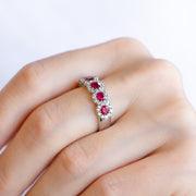 14K White Gold 1.82ct Five-Stone Ruby Band with Round Diamond Halos. Bichsel Jewelry in Sedalia, MO. Shop gemstone rings online or in-store!