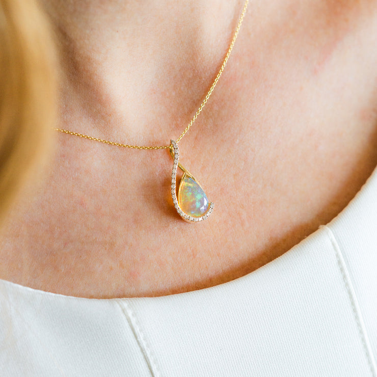 14K Yellow Gold 1.60ct Pear Shape Opal Pendant with Diamond Accents. Bichsel Jewelry in Sedalia, MO. Shop gemstone styles online or in-store today!