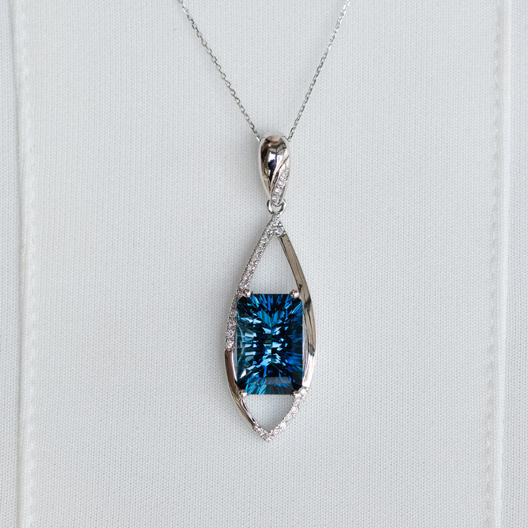 14K White Gold 4.70ct Radiant Fantasy Cut London Blue Topaz Pendant with Diamond Accents. Bichsel Jewelry in Sedalia, MO. Shop gemstone rings online or in-store today!