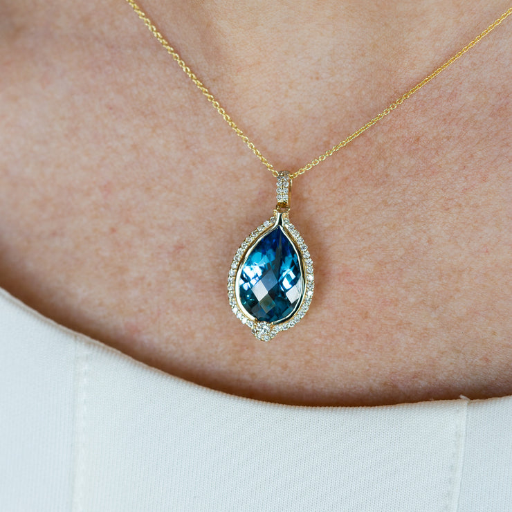 14K Yellow Gold 6.25ct Pear Shape Swiss Blue Topaz Pendant with Diamond Halo. Bichsel Jewelry in Sedalia, MO. Shop gemstone styles online or in-store!