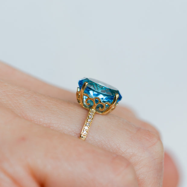14K Yellow Gold 5.33ct Oval Swiss Blue Topaz Ring with Diamond Band. Bichsel Jewelry in Sedalia, MO. Shop gemstone styles online or in-store!