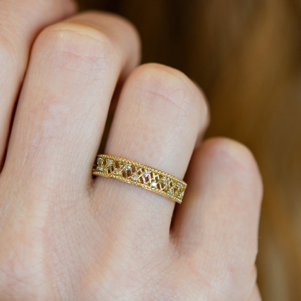 Woven 14K Yellow Gold 0.10ct Diamond Band with Beaded Edge. Bichsel Jewelry in Sedalia, MO. Shop ring styles online or in-store today!