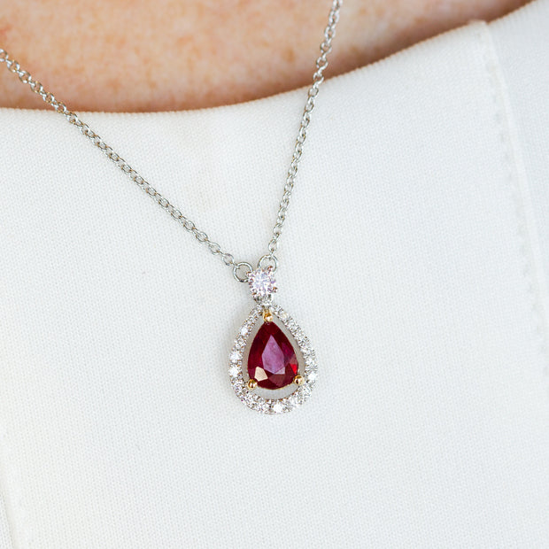 14K White Gold 0.78ct Pear Ruby Necklace with 0.23ct Diamond Halo. Bichsel Jewelry in Sedalia, MO. Shop gemstone jewelry online or in-store today!