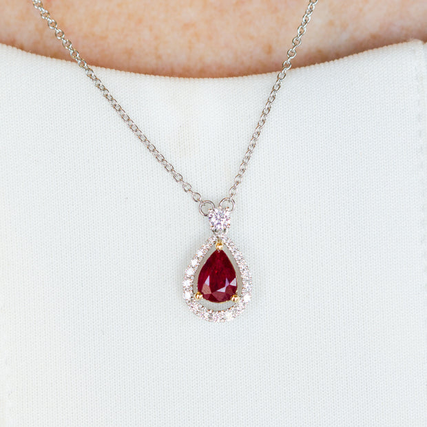 14K White Gold 0.78ct Pear Ruby Necklace with 0.23ct Diamond Halo. Bichsel Jewelry in Sedalia, MO. Shop gemstone jewelry online or in-store today!