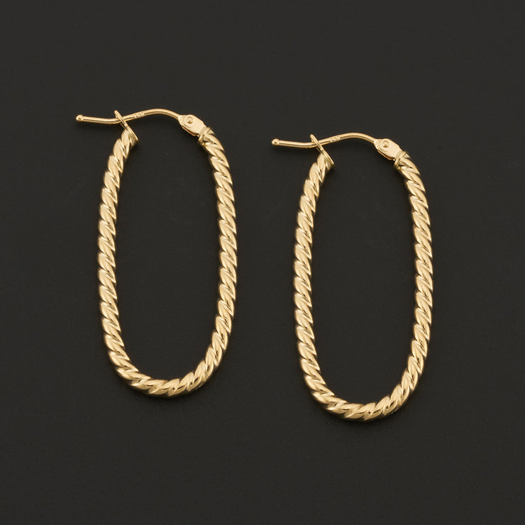 14K Yellow Gold 2x30mm Oval Twist Rope Hoop Earrings. Bichsel Jewelry in Sedalia, MO. Shop gold earrings online or in-store today!