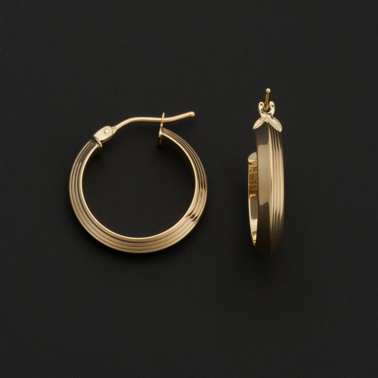 14K Yellow Gold 3x15mm Faceted Lined Hoop Earrings. Bichsel Jewelry in Sedalia, MO. Shop gold earrings online or in-store today!