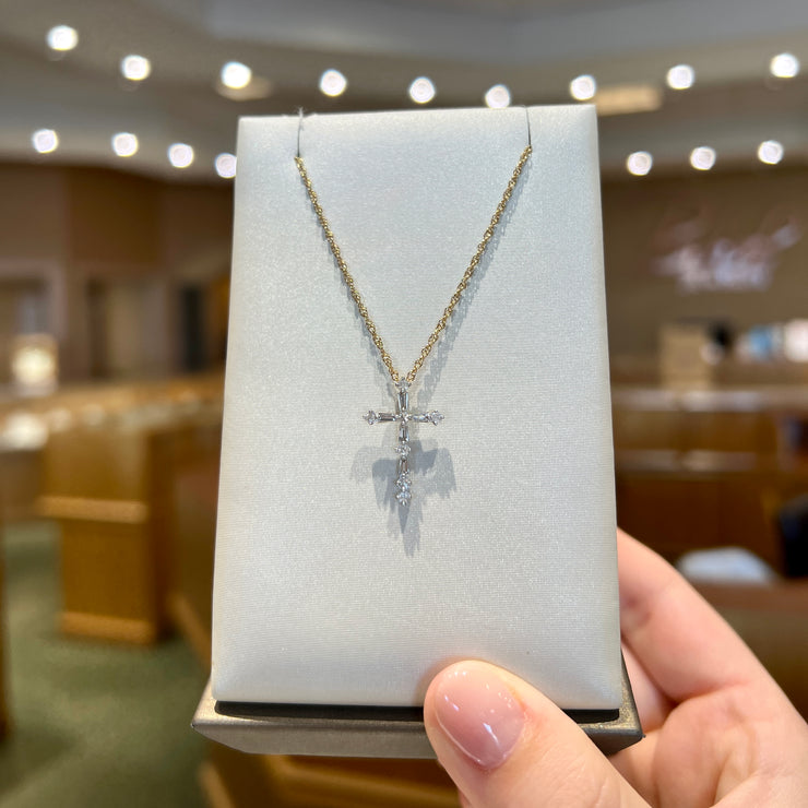 0.25ct Baguette & Round Diamond Cross Necklace. Yellow Gold plated over Sterling Silver. Bichsel Jewelry in Sedalia, MO. Shop online or in-store today!