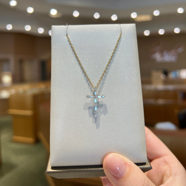 0.25ct Baguette & Round Diamond Cross Necklace. Yellow Gold plated over Sterling Silver. Bichsel Jewelry in Sedalia, MO. Shop online or in-store today!