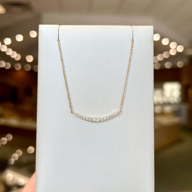 14K Yellow Gold 0.20ct Curved Diamond Crescent Bar Necklace. Bichsel Jewelry in Sedalia, MO. Shop online or in-store!