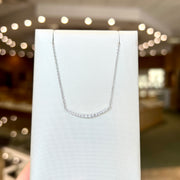 14K White Gold 0.20ct Curved Diamond Crescent Bar Necklace. Bichsel Jewelry in Sedalia, MO. Shop online or in-store!