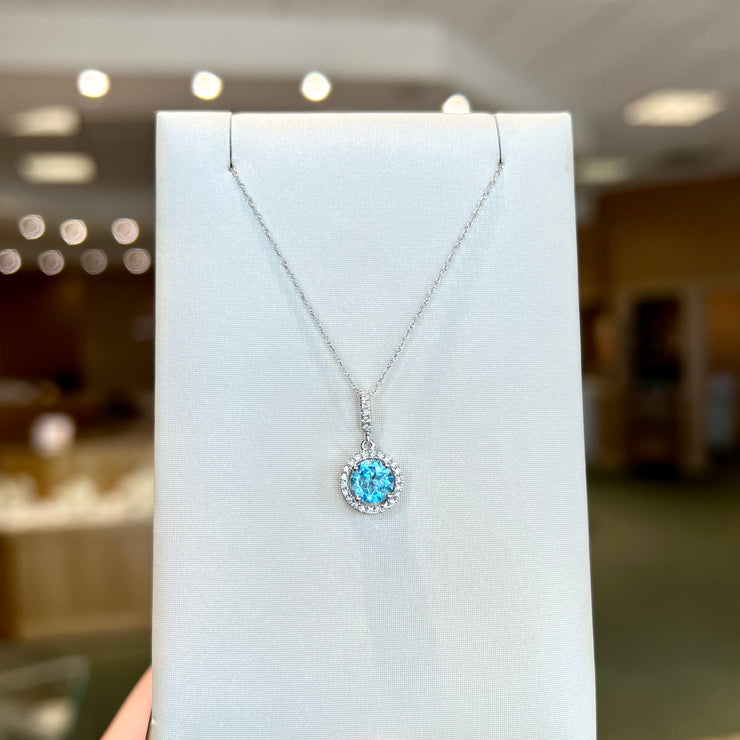 14K White Gold Round 1.00ct Blue Topaz Necklace with Diamond Halo & Bail. Bichsel Jewelry in Sedalia, MO. Shop gemstone styles online or in-store!