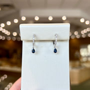 10K White Gold Diamond Huggie Hoop Earrings with Petite Pear Shape Sapphire Dangles. Bichsel Jewelry in Sedalia, MO. Shop gemstone hoops online or in-store!