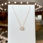 14K Rose Gold 0.30ct Round Opal Pendant with Diamond Halo. Bichsel Jewelry in Sedalia, MO. Shop opal gem styles online or in-store today! 