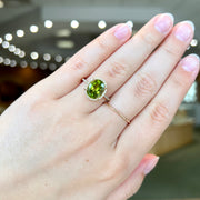 14K Yellow Gold 2.25ct Oval Peridot Ring with Diamond Halo & Side Diamonds. Bichsel Jewelry in Sedalia, MO. Shop gemstone rings online or in-store today!