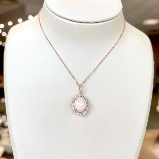 14K Rose Gold 3.00ct Opal Pendant with Diamond Halo & Bail. Bichsel Jewelry in Sedalia, MO. Shop opal gem styles online or in-store today! 