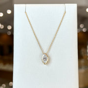 14K Yellow Gold 0.63ct Marquise Lab Grown Diamond Bezel Solitaire Pendant. Bichsel Jewelry in Sedalia, MO. Shop diamond jewelry online or in-store!