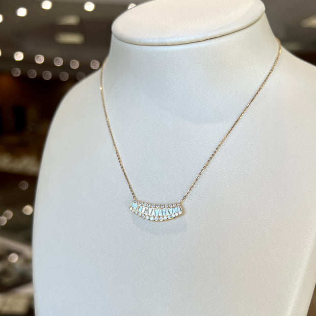 14K Yellow Gold 0.71ct Curved Three Row Round & Baguette Lab Grown Diamond Pendant. Bichsel Jewelry in Sedalia, MO. Shop diamond jewelry online or in-store today!