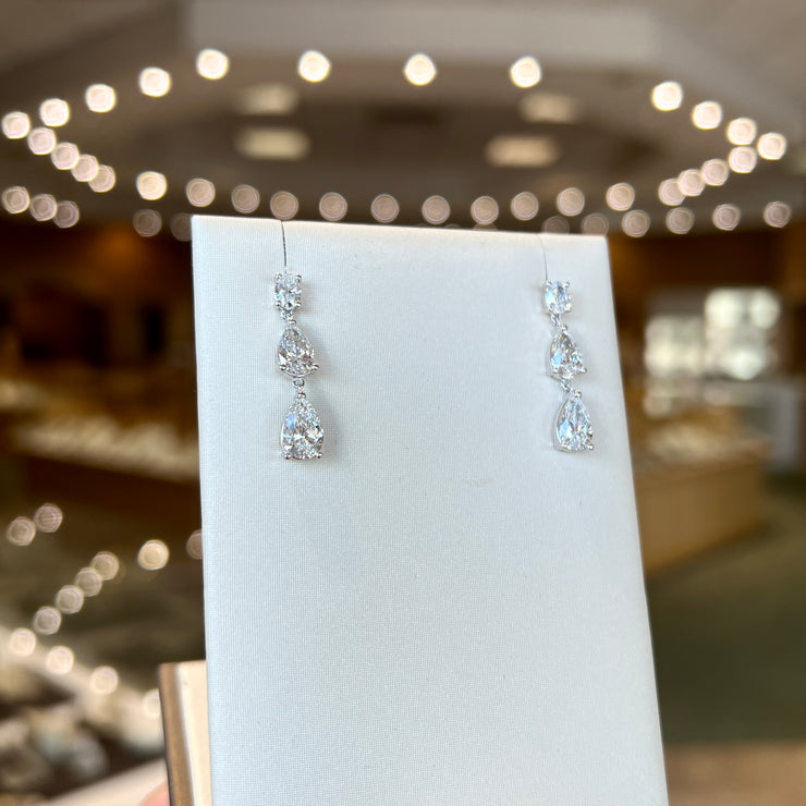 14K White Gold 3.35ct Oval & Pear Lab Grown Diamond Graduated Dangle Drop Earrings. Bichsel Jewelry in Sedalia, MO. Shop online or in-store today!