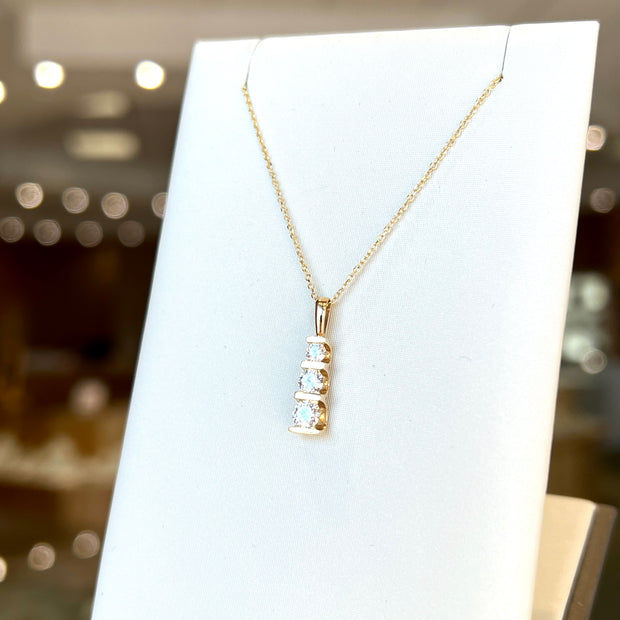 14K Yellow Gold Three-Stone 0.50ct Round Diamond Vertical Bar Necklace. Bichsel Jewelry in Sedalia, MO. Shop online or in-store today!