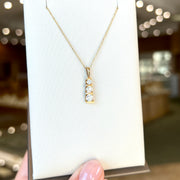 14K Yellow Gold Three-Stone 0.50ct Round Diamond Vertical Bar Necklace. Bichsel Jewelry in Sedalia, MO. Shop online or in-store today!