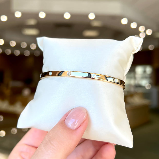 14K Yellow Gold 0.35ct Round Diamond Inlay Bangle Bracelet. Bichsel Jewelry in Sedalia, MO. Shop gold and diamond jewelry online or in-store!