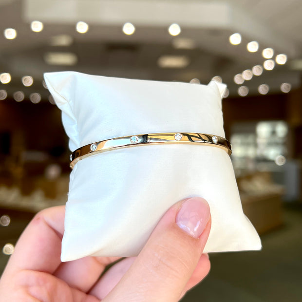 14K Yellow Gold 0.35ct Round Diamond Inlay Bangle Bracelet. Bichsel Jewelry in Sedalia, MO. Shop gold and diamond jewelry online or in-store!