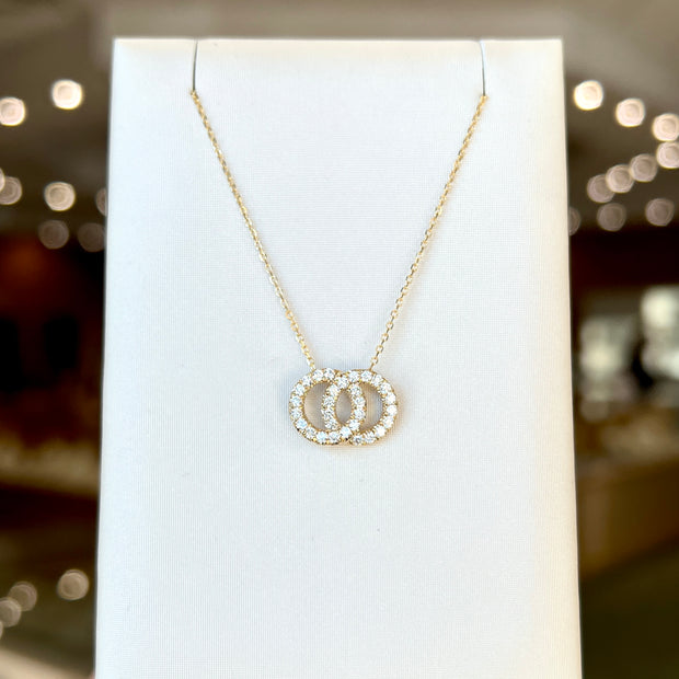 14K Yellow Gold Interlocking Infinity 0.40ct Round Diamond Circles Necklace. Bichsel Jewelry in Sedalia, MO. Shop online or in-store today!