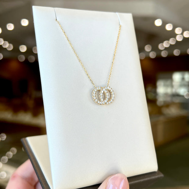 14K Yellow Gold Interlocking Infinity 0.40ct Round Diamond Circles Necklace. Bichsel Jewelry in Sedalia, MO. Shop online or in-store today!