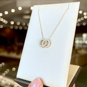 14K Yellow Gold Interlocking Infinity 0.40ct Round Diamond Circles Necklace. Bichsel Jewelry in Sedalia, MO. Shop online or in-store today!