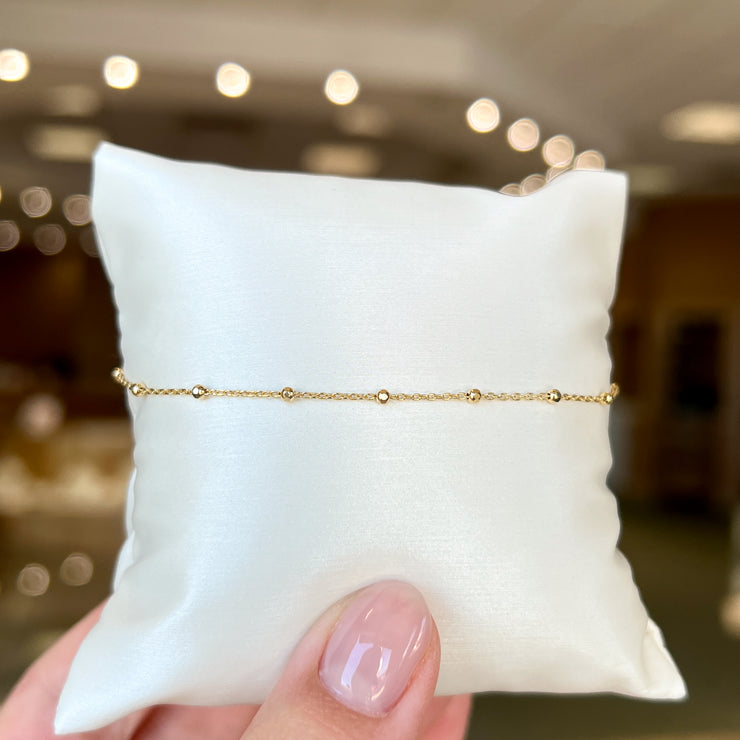 14K Yellow Gold Faceted Beaded Chain Ankle Bracelet, 9" and 10". Bichsel Jewelry in Sedalia, MO. Shop online or in-store today!