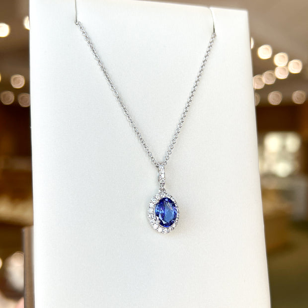 14K White Gold Oval 1.30ct Tanzanite Necklace with Diamond Halo & Bail. Bichsel Jewelry in Sedalia, MO. Shop gemstone styles online or in-store today!