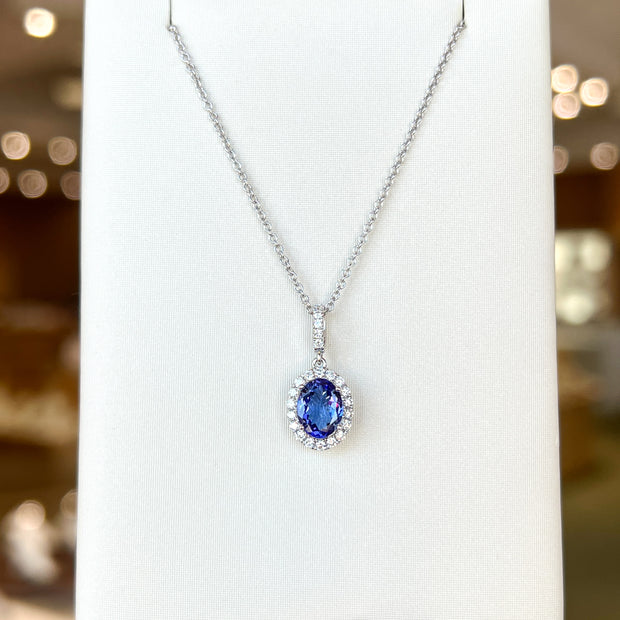 14K White Gold Oval 1.30ct Tanzanite Necklace with Diamond Halo & Bail. Bichsel Jewelry in Sedalia, MO. Shop gemstone styles online or in-store today!