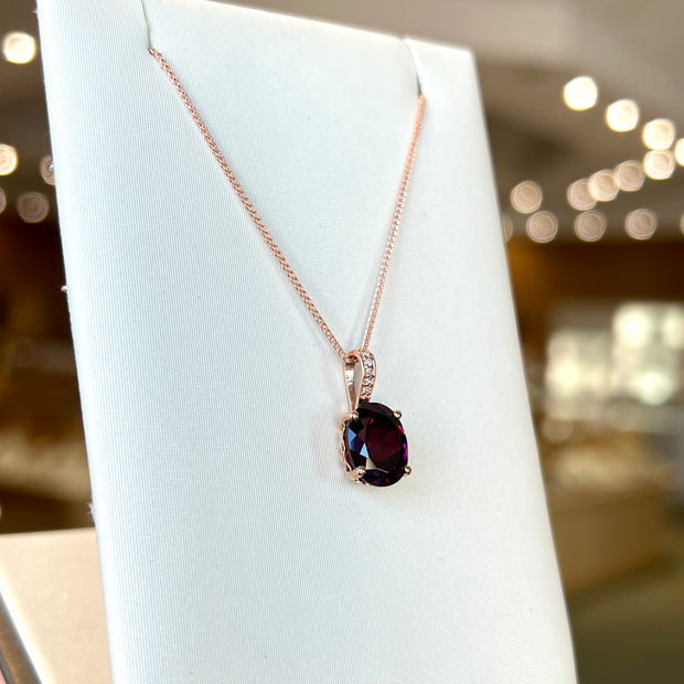 14K Rose Gold Rhodolite Garnet Necklace with Diamond-Accented Bail. Bichsel Jewelry in Sedalia, MO. Shop online or in-store today!