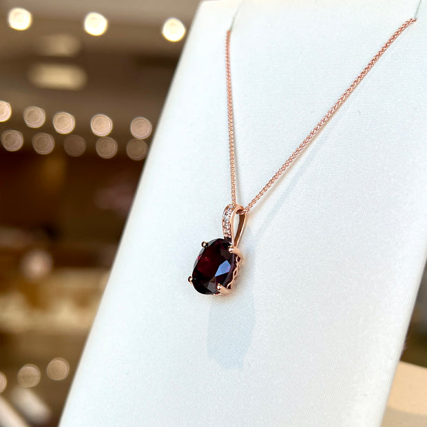 14K Rose Gold Rhodolite Garnet Necklace with Diamond-Accented Bail. Bichsel Jewelry in Sedalia, MO. Shop online or in-store today!