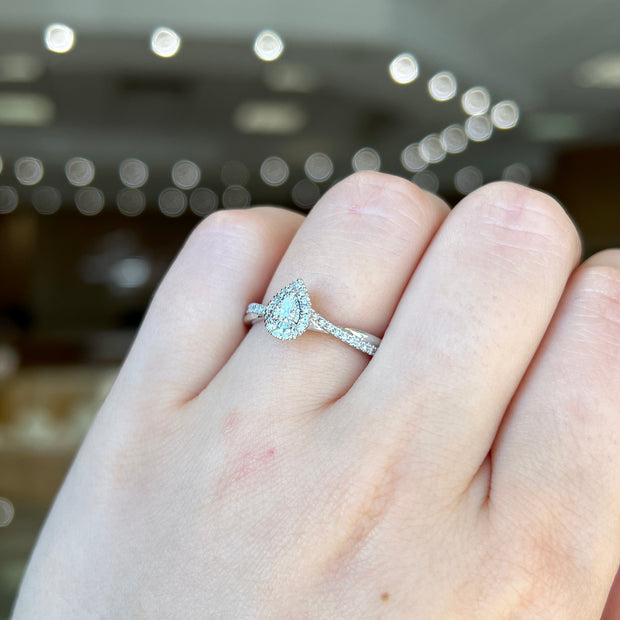 14K White Gold Petite Pear Diamond Halo Engagement Ring with Twist Sides. Bichsel Jewelry in Sedalia, MO. Shop online or in-store!