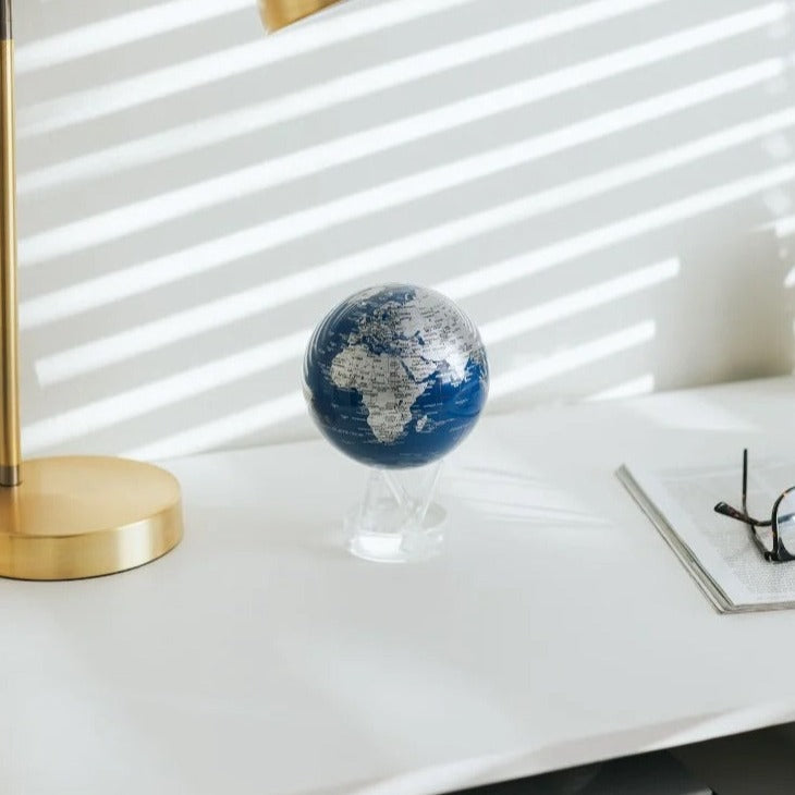 4.5" Blue & Silver World Map Spinning MOVA Globe with Acrylic Base. Powered by Ambient Light & Magnets. No cords or batteries needed. Shop online or in-store today!