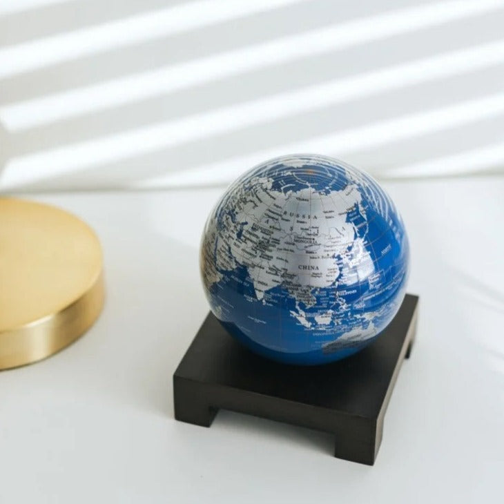 4.5" Blue & Silver World Map Spinning MOVA Globe with Acrylic Base. Powered by Ambient Light & Magnets. No cords or batteries needed. Shop online or in-store today!