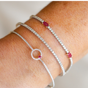 14K White Gold Round Ruby & 0.55ct Diamond Flexible Hooked Bangle Bracelet. Bichsel Jewelry in Sedalia, MO. Shop gemstone styles online or in-store today!