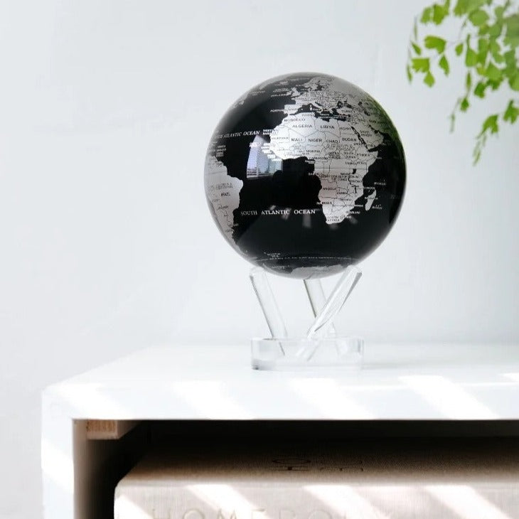 4.5" Black & Silver Spinning MOVA World Map Globe with Acrylic Base. Powered by Ambient Light & Magnets. No cords or batteries needed. Shop online or in-store today!