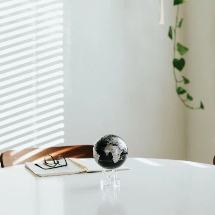 4.5" Black & Silver Spinning MOVA World Map Globe with Acrylic Base. Powered by Ambient Light & Magnets. No cords or batteries needed. Shop online or in-store today!