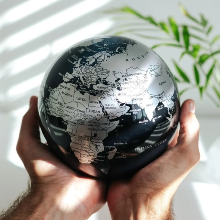 4.5" Black & Silver Spinning MOVA World Map Globe with Acrylic Base. Powered by Ambient Light & Magnets. No cords or batteries needed. Shop online or in-store today!